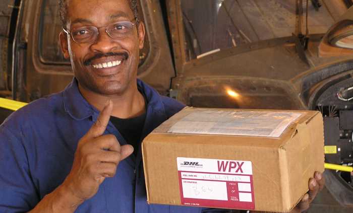man holding a shipment parcel