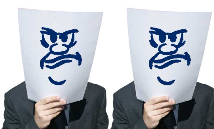 man holding a sheet of paper with agressive face