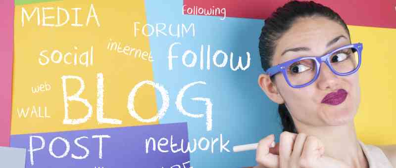 How to Start a Blog - Start Blogging - Step-by-Step Guide - lady with purple glasses in front of colorful board with blog related terms