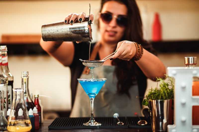 woman preparing cocktail