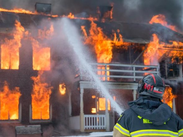 firemen extinguishing house on fire
