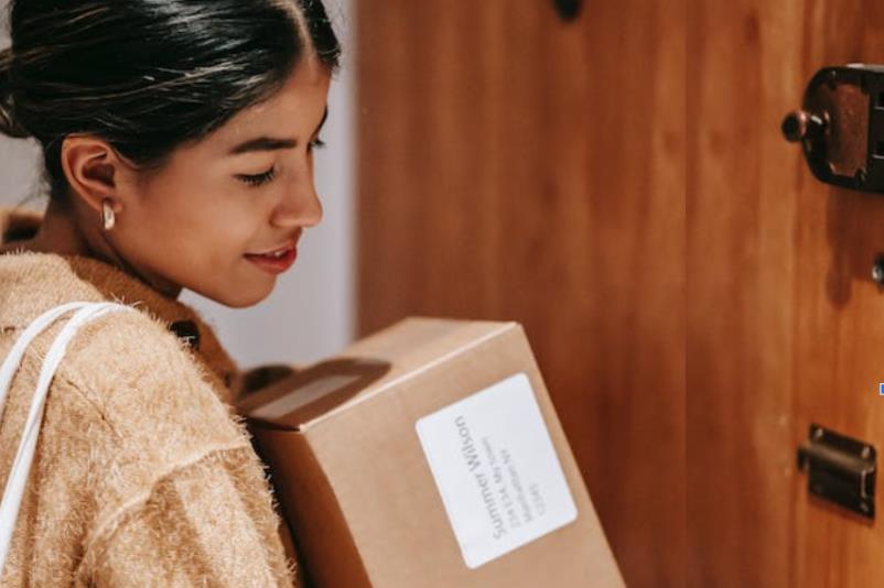 woman holding a carton box