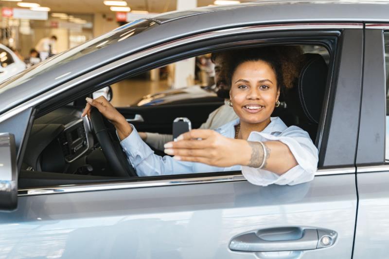 woman buying a new car