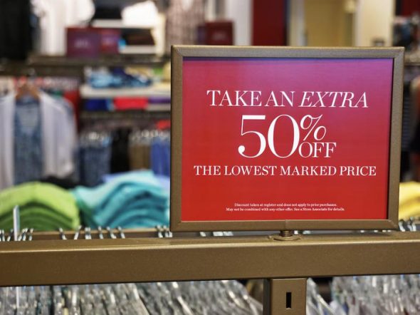 50% off price label on clothing rack
