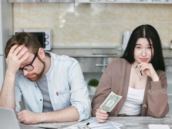 couple working on their personal finance on the kitchen table