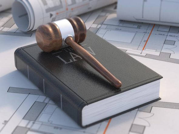 Construction, labor law concept. Judge gavel and book on project blueprint background. 3d illustration