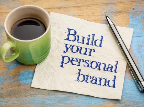 build your personal brand note with a coffee cup and a pen