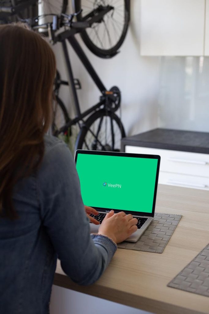 woman using veepn on her laptop