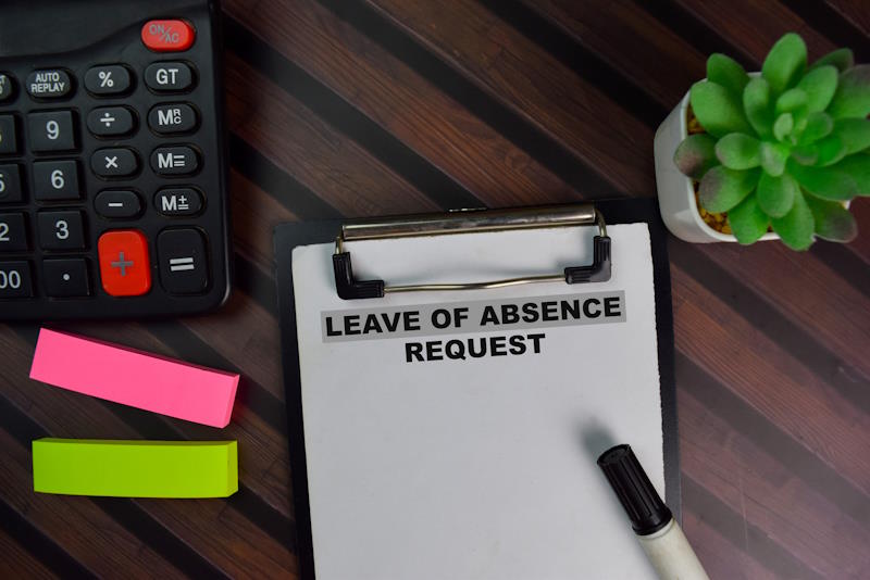 Leave of Absence Request write on a paperwork isolated on Wooden