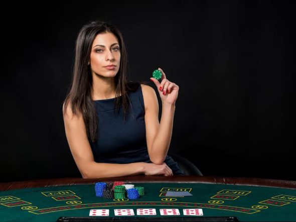 woman with poker cards and chips
