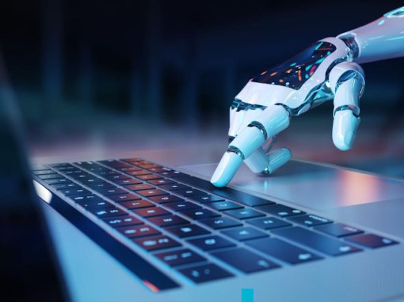 humanoid robot hand on laptop keyboard